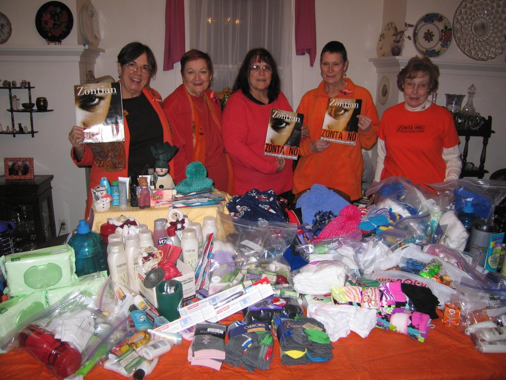 November 25, 2013, Zonta Club of Greeley members with donations to A Women's Place, the battered women's shelter.