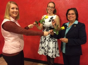 New Members Amelia Kelso and Tessa Cedilla being presented with the traditional yellow rose by past president Tasha Bauman at our November 16, 2017 induction ceremony