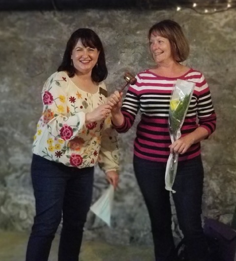 New President Vonnie Kallemeyn receives the gavel from outgoing President Jacque Storm