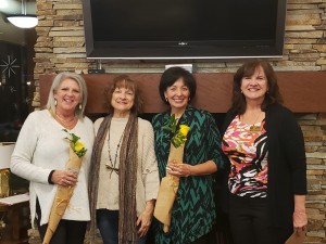 January 6, 2020. The yellow rose is presented to our two newest members - from left to right: Sunni Madrid, Marilyn Harding (club sponsor), Barbara Garcia, and Julie Browning (President) 
